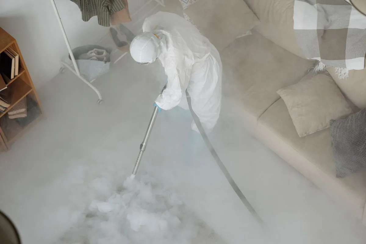 Biohazard cleanup technician in protective equipment, Milton, NY